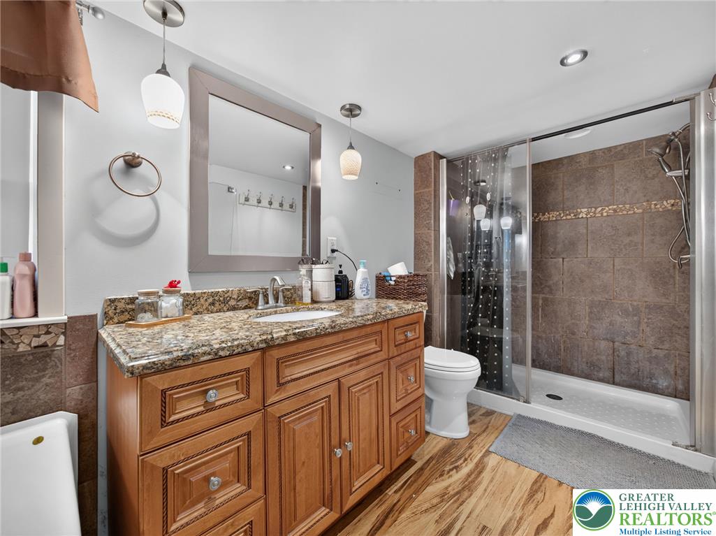 2628 Levans Road Coplay, PA 18037 - Photo 46 of 54 Granite counters and a spacious vanity provide ample storage in this well-appointed bathroom.