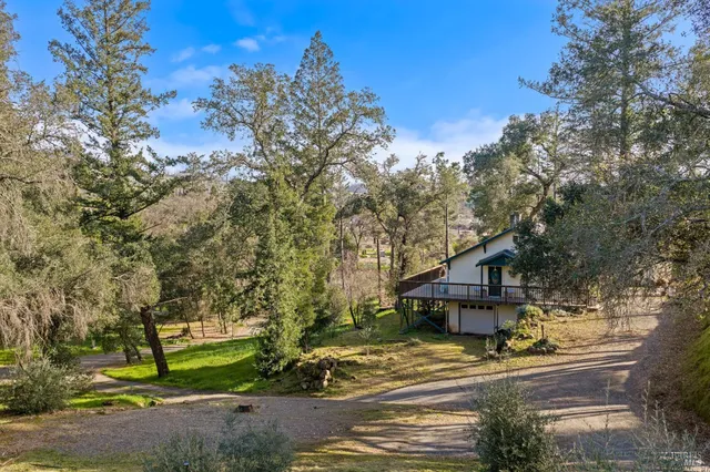 a view of balcony and yard