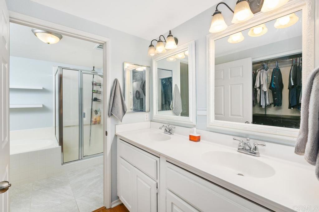 9728 Marilla Drive, Unit 712 Lakeside, CA 92040 - Photo 15 of 25 a bathroom with a double vanity sink mirror and double