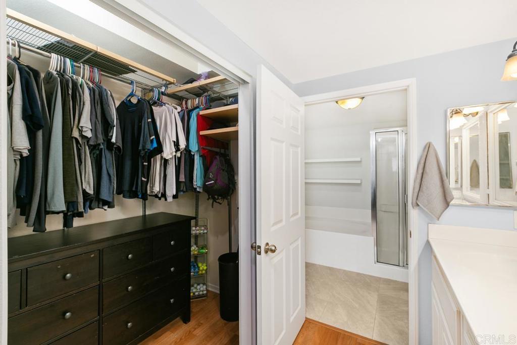 9728 Marilla Drive, Unit 712 Lakeside, CA 92040 - Photo 16 of 25 a view of walk in closet with clothes and shoes