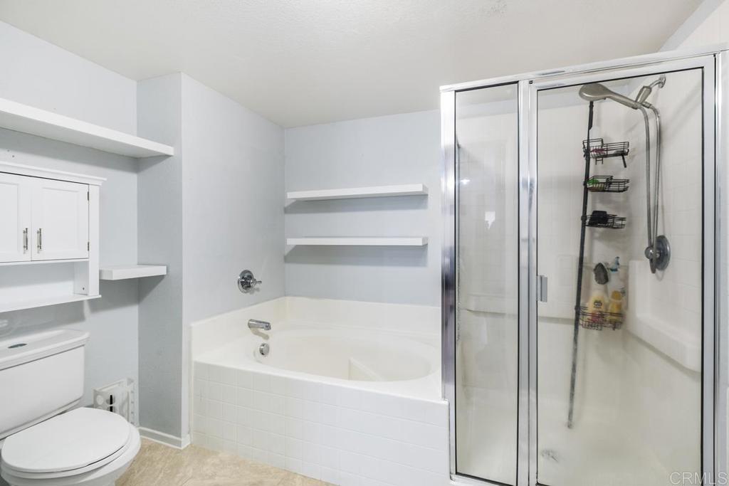 9728 Marilla Drive, Unit 712 Lakeside, CA 92040 - Photo 17 of 25 a bathroom with a bathtub toilet and shower