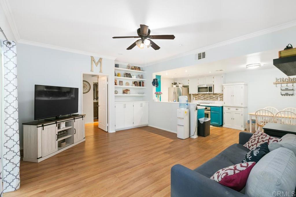 9728 Marilla Drive, Unit 712 Lakeside, CA 92040 - Photo 2 of 25 a living room with furniture and a flat screen tv