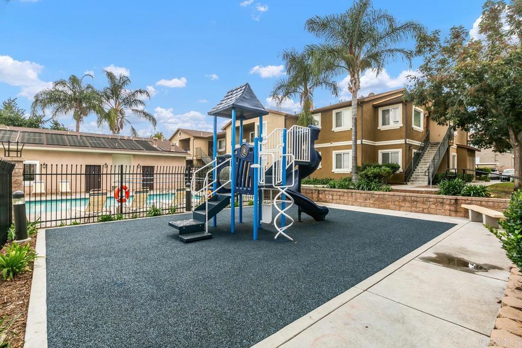 9728 Marilla Drive, Unit 712 Lakeside, CA 92040 - Photo 23 of 25 a view of a house with a swimming pool and sitting area