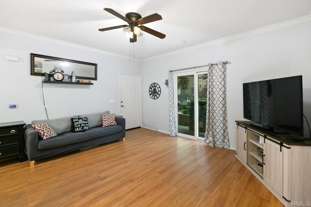 9728 Marilla Drive, Unit 712 Lakeside, CA 92040 - Photo 5 of 25 a living room with furniture and a flat screen tv