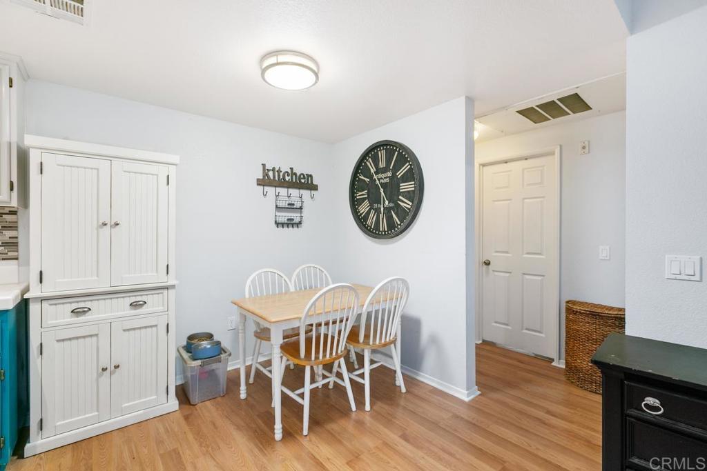 9728 Marilla Drive, Unit 712 Lakeside, CA 92040 - Photo 6 of 25 a view of a dining room with furniture and wooden floor
