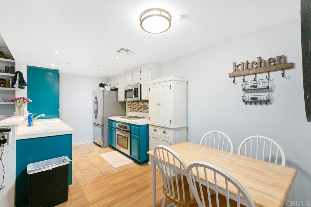 9728 Marilla Drive, Unit 712 Lakeside, CA 92040 - Photo 7 of 25 a kitchen that has a cabinets counter space and appliances
