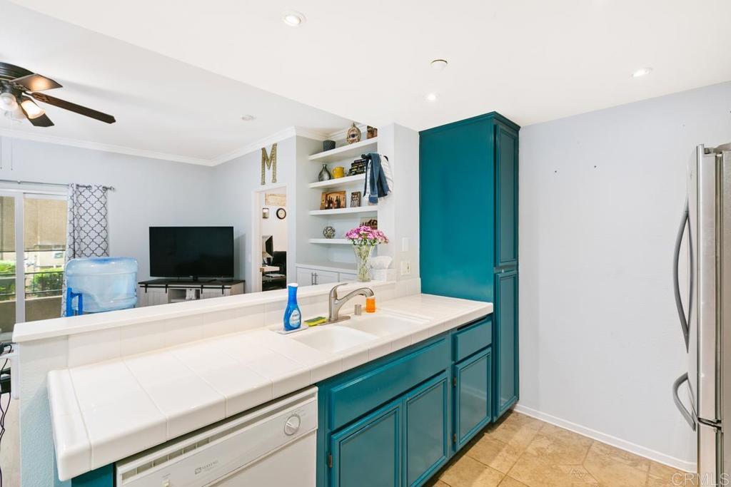 9728 Marilla Drive, Unit 712 Lakeside, CA 92040 - Photo 10 of 25 a room with a bed and a flat screen tv