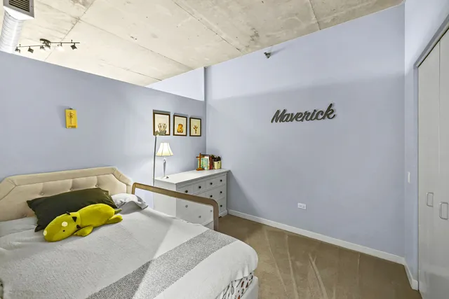 a bedroom with a bed and a couch