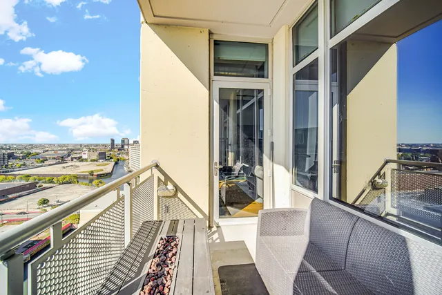 a view of balcony with furniture
