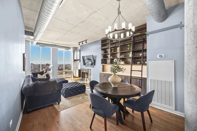 a view of a dining room with furniture window and wooden floor