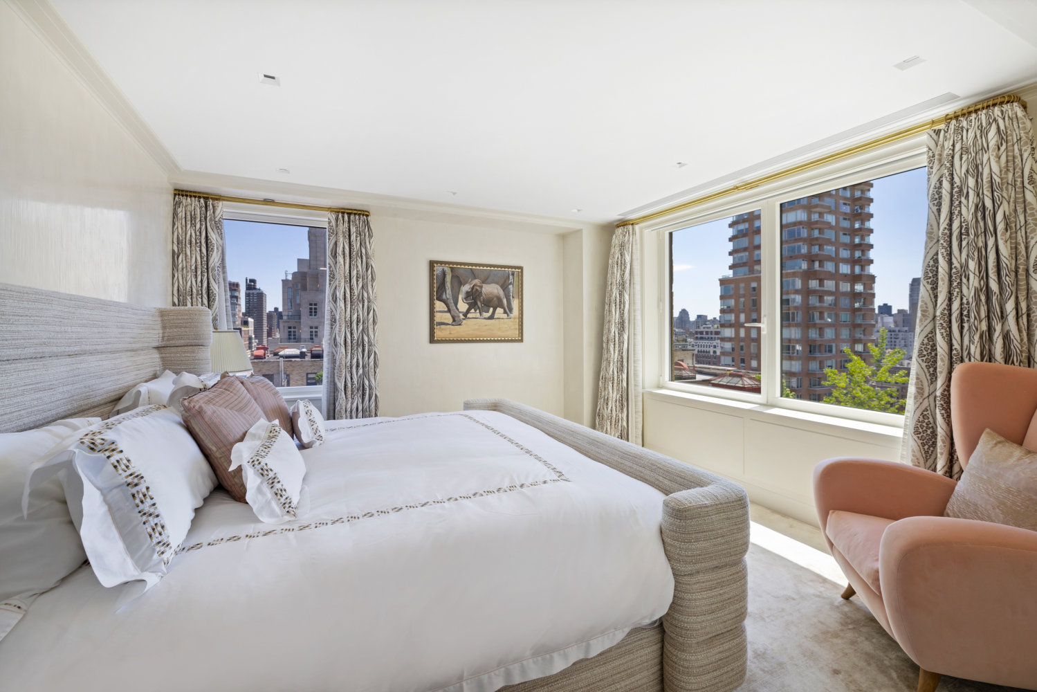 1049 5th Avenue, Unit 19B Manhattan, NY 10028 - Photo 14 of 20 a bedroom with bed couch and window