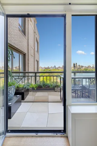 a view of a balcony with chairs