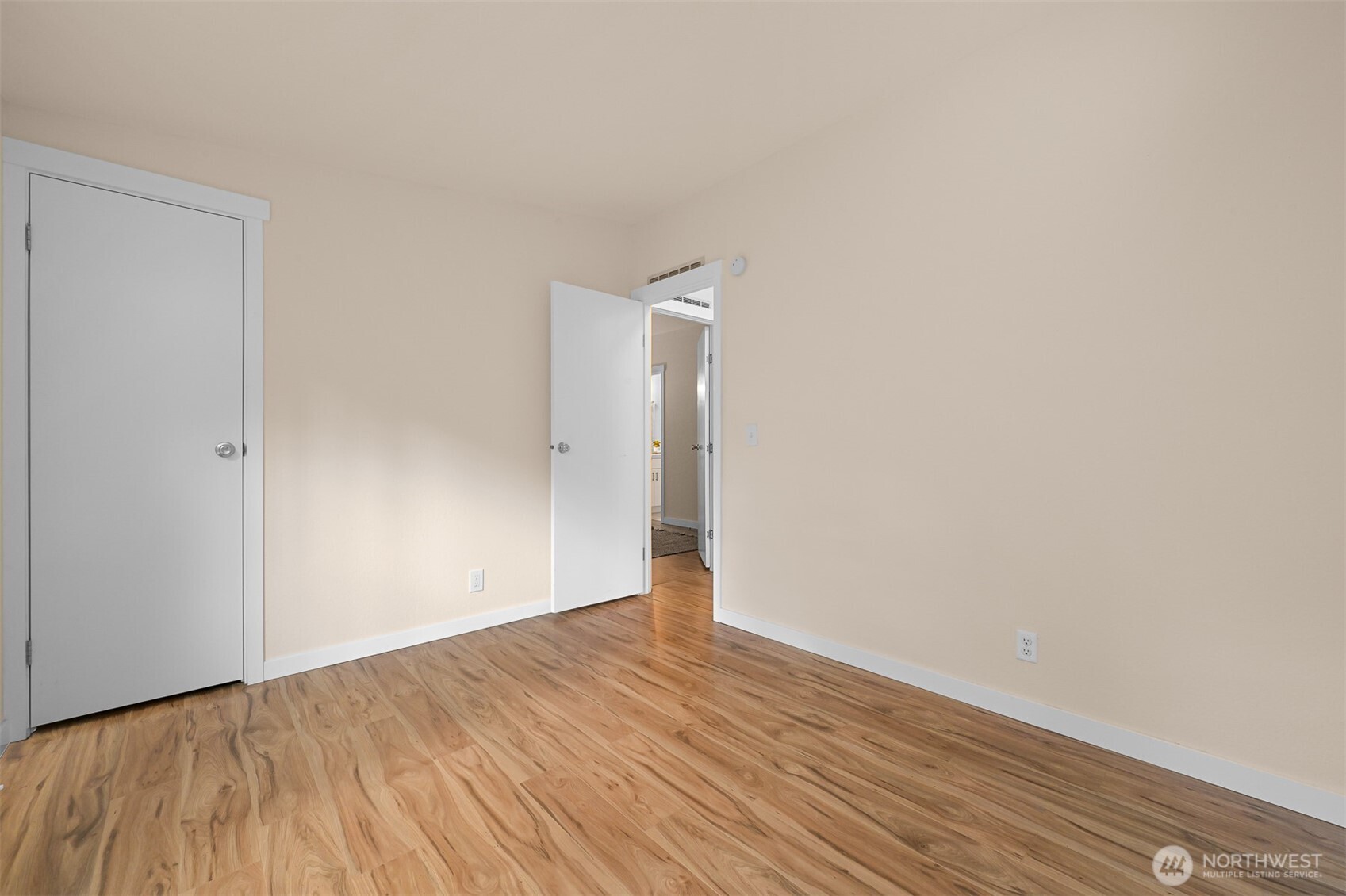 6159 Cedar Lane Maple Falls, WA 98266 - Photo 24 of 31 a view of an empty room with wooden floor and a window