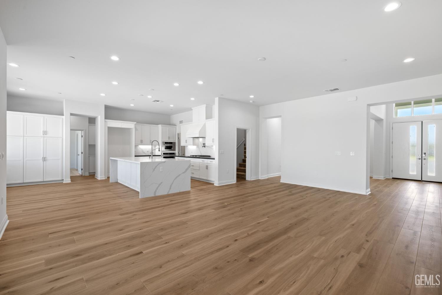Undisclosed Address Bakersfield, CA 93311 - Photo 16 of 71 a view of kitchen with kitchen island wooden floor center island and stainless steel appliances