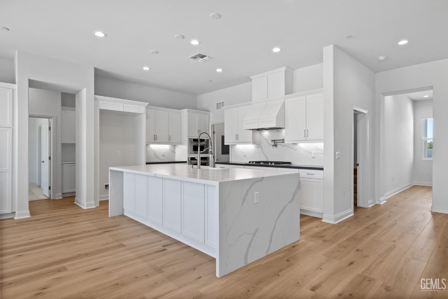 Undisclosed Address Bakersfield, CA 93311 - Photo 17 of 71 a kitchen with stainless steel appliances kitchen island granite countertop a refrigerator and a sink