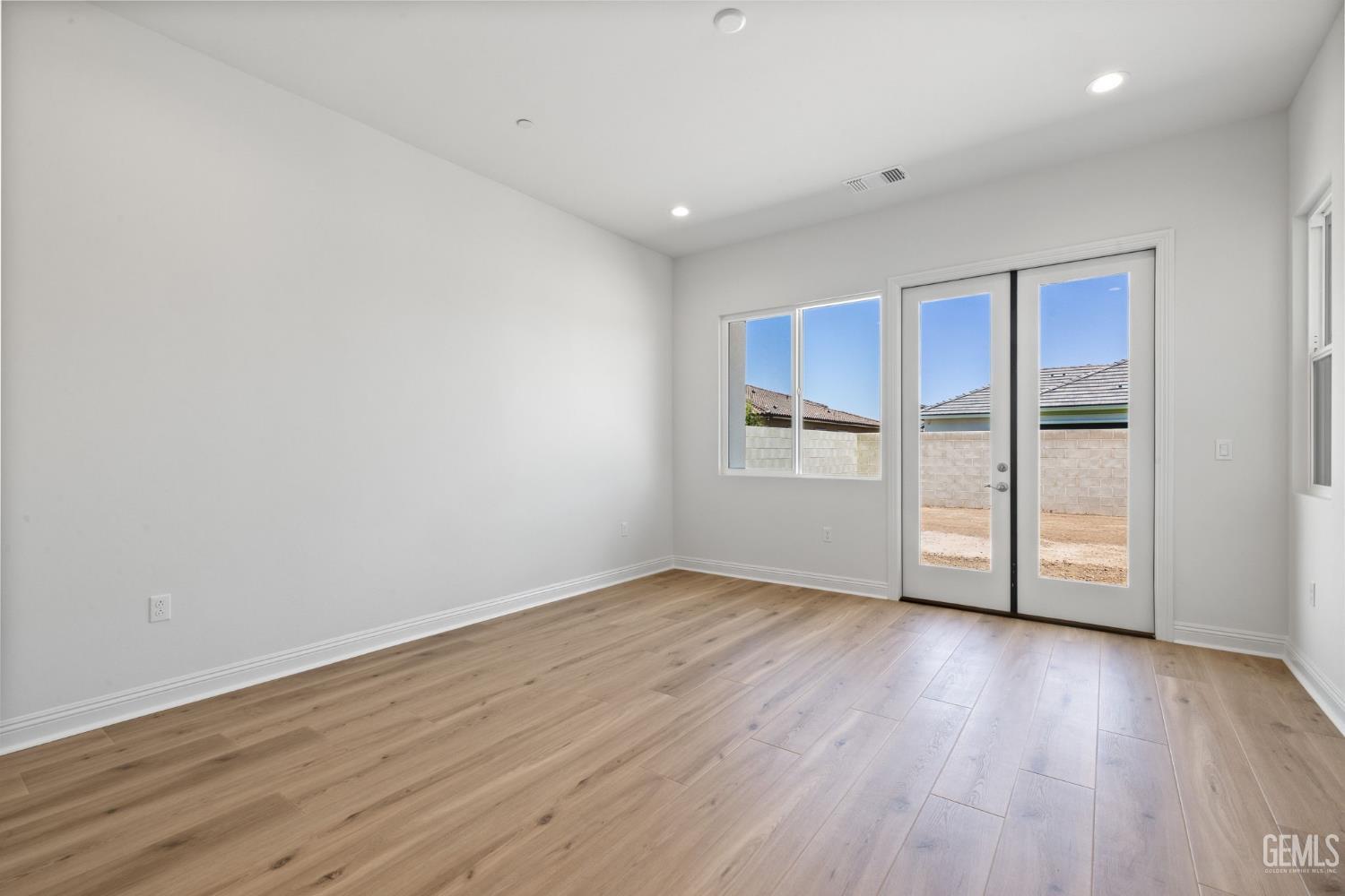 Undisclosed Address Bakersfield, CA 93311 - Photo 27 of 71 a view of empty room with wooden floor