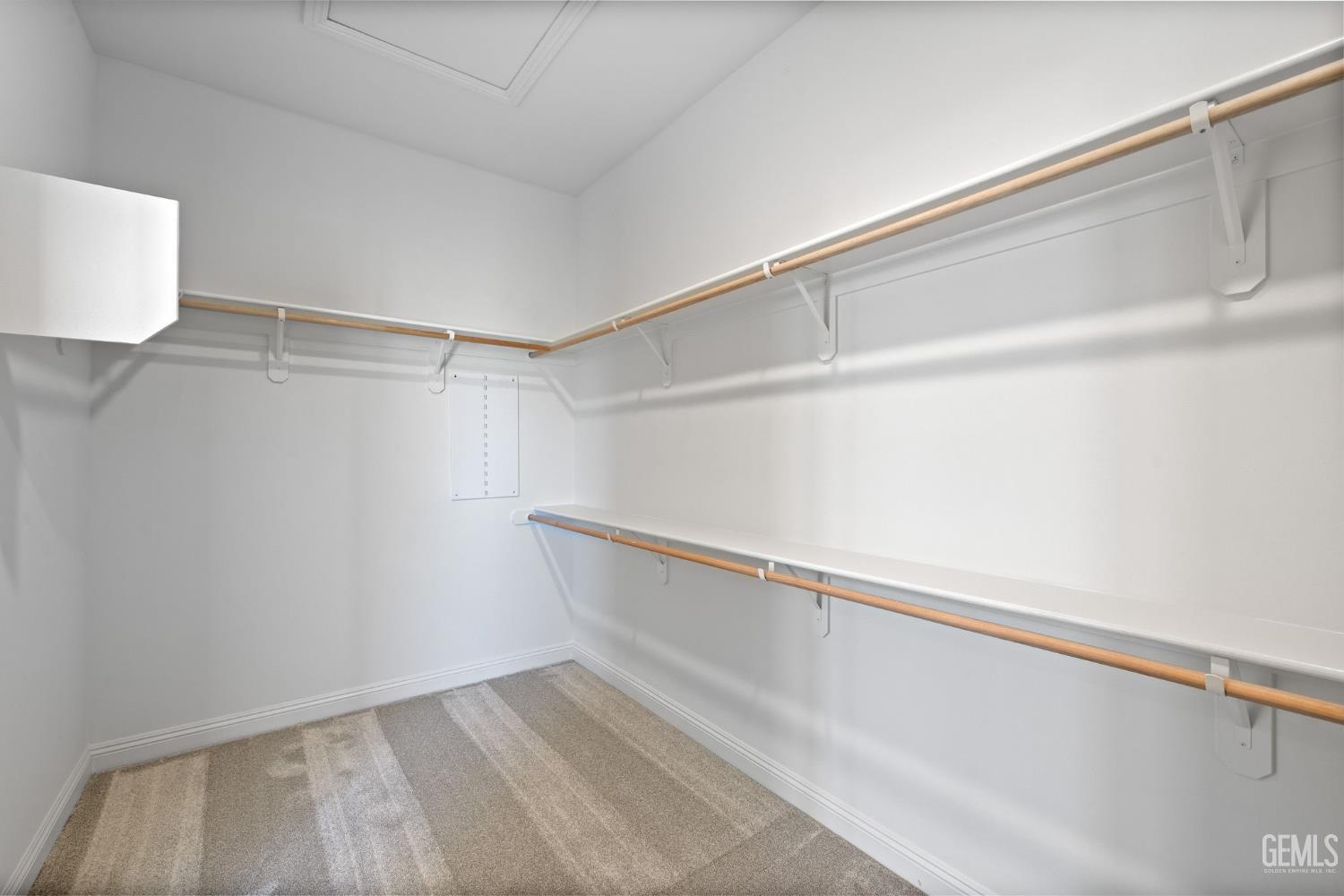 Undisclosed Address Bakersfield, CA 93311 - Photo 32 of 71 a view of an empty walk in closet