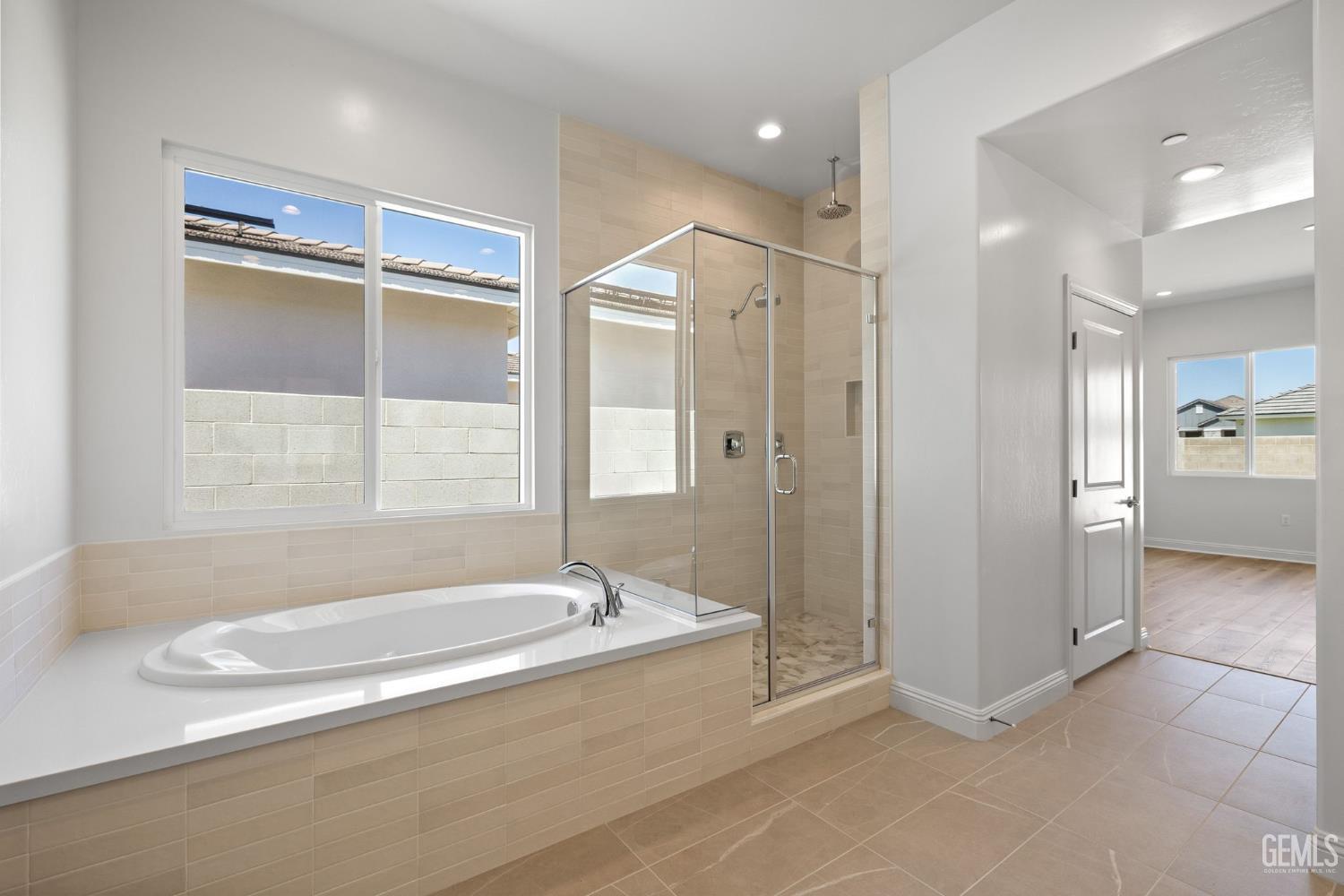 Undisclosed Address Bakersfield, CA 93311 - Photo 33 of 71 a bathroom with a tub and a shower