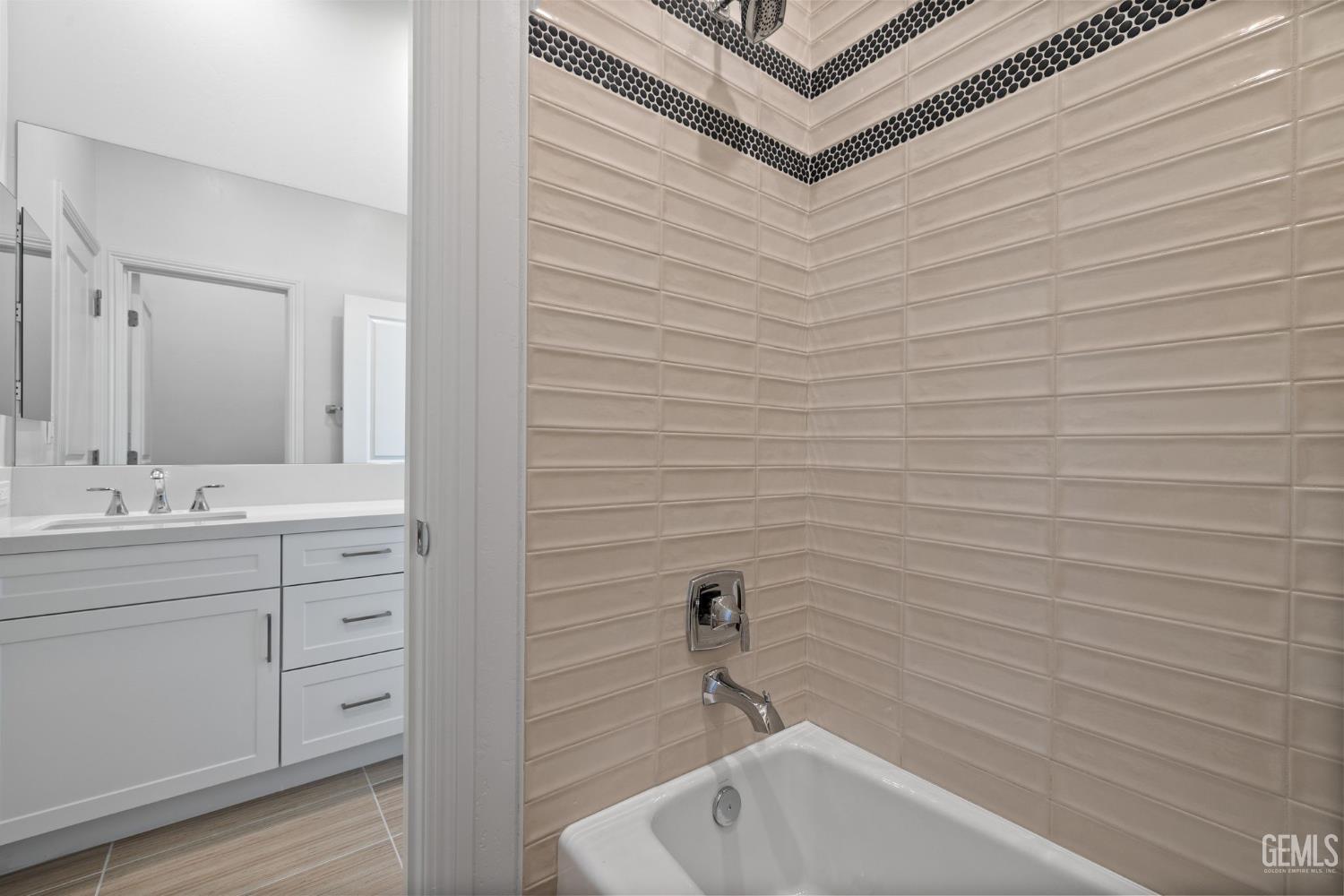 Undisclosed Address Bakersfield, CA 93311 - Photo 38 of 71 a bathroom with a bathtub and shower