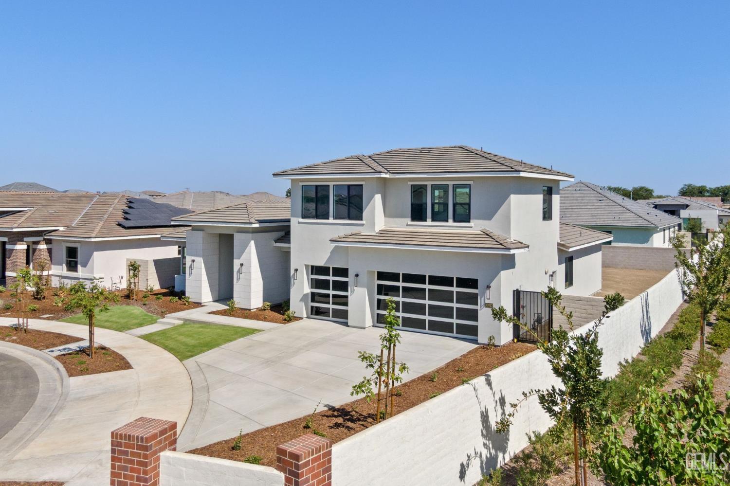 Undisclosed Address Bakersfield, CA 93311 - Photo 4 of 71 a front view of a house with a porch