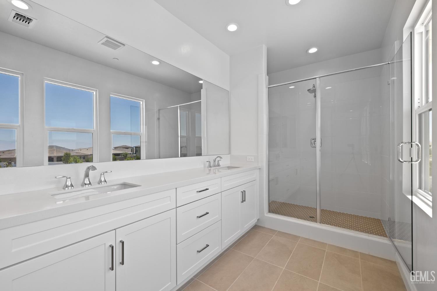 Undisclosed Address Bakersfield, CA 93311 - Photo 50 of 71 a spacious bathroom with double sink and shower