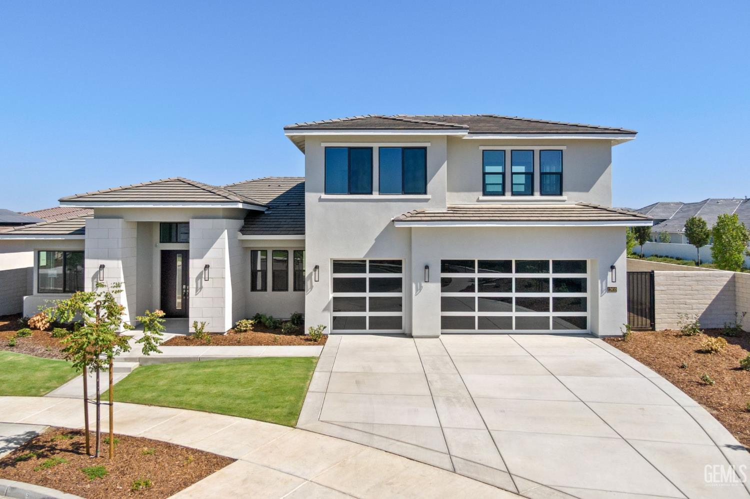 Undisclosed Address Bakersfield, CA 93311 - Photo 5 of 71 a front view of a house with a yard