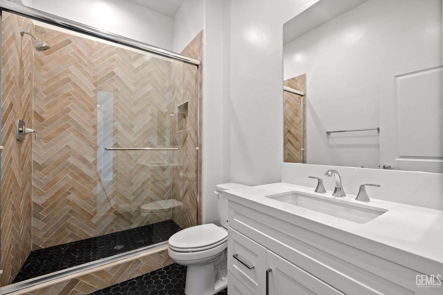 Undisclosed Address Bakersfield, CA 93311 - Photo 52 of 71 a bathroom with a sink a toilet and shower curtain