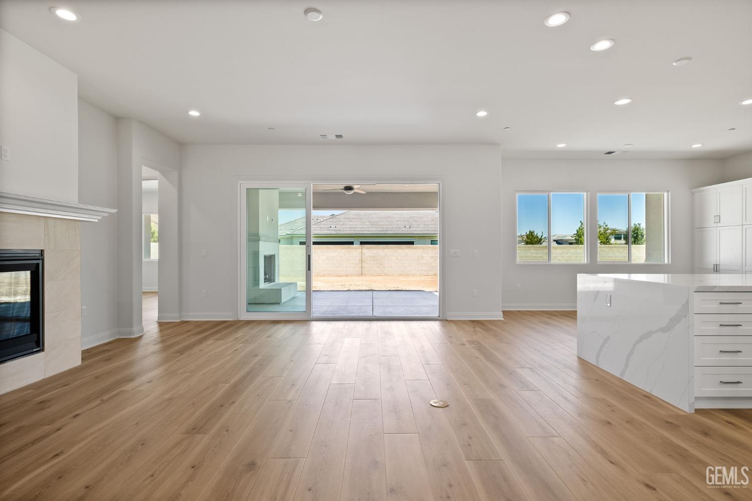 Undisclosed Address Bakersfield, CA 93311 - Photo 55 of 71 an empty room with wooden floor and windows
