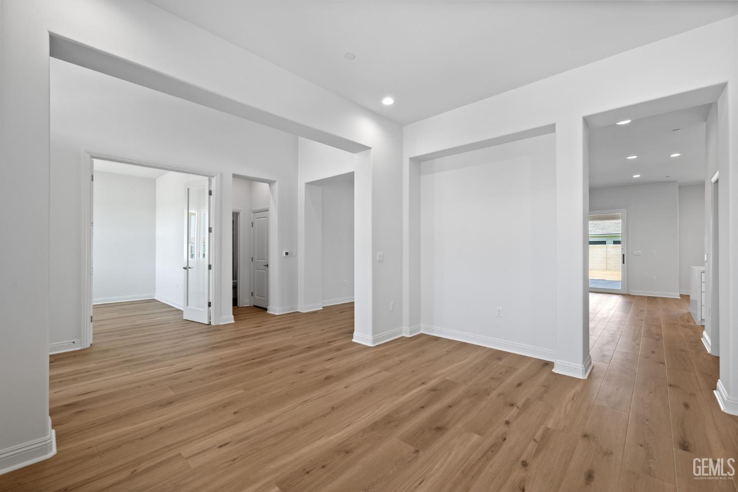 Undisclosed Address Bakersfield, CA 93311 - Photo 10 of 71 a view of empty room with wooden floor