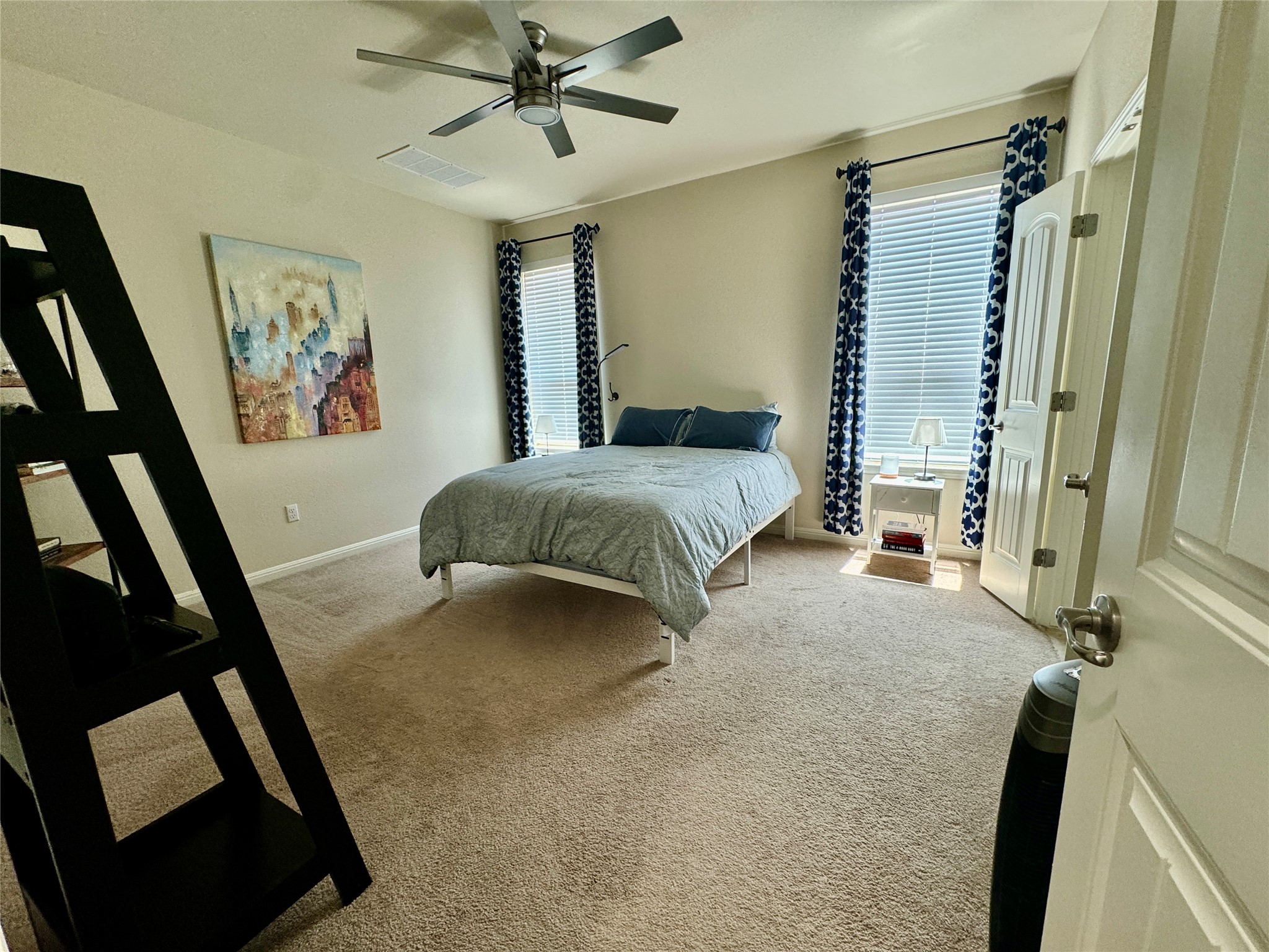 5904 Baythorne Drive Austin, TX 78747 - Photo 11 of 24 Bedroom with carpet and a ceiling fan