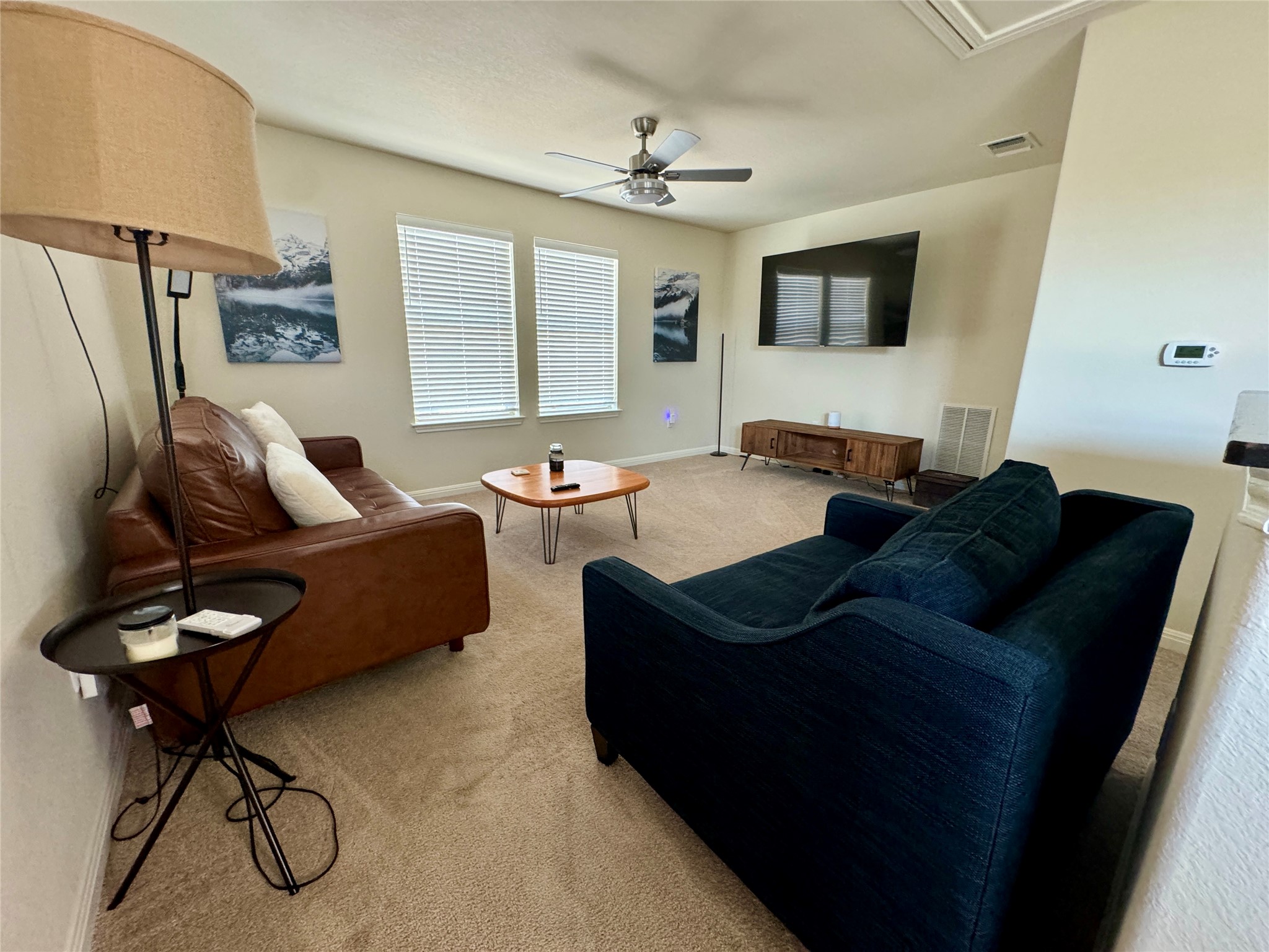 5904 Baythorne Drive Austin, TX 78747 - Photo 17 of 24 Loft featuring light carpet and a ceiling fan