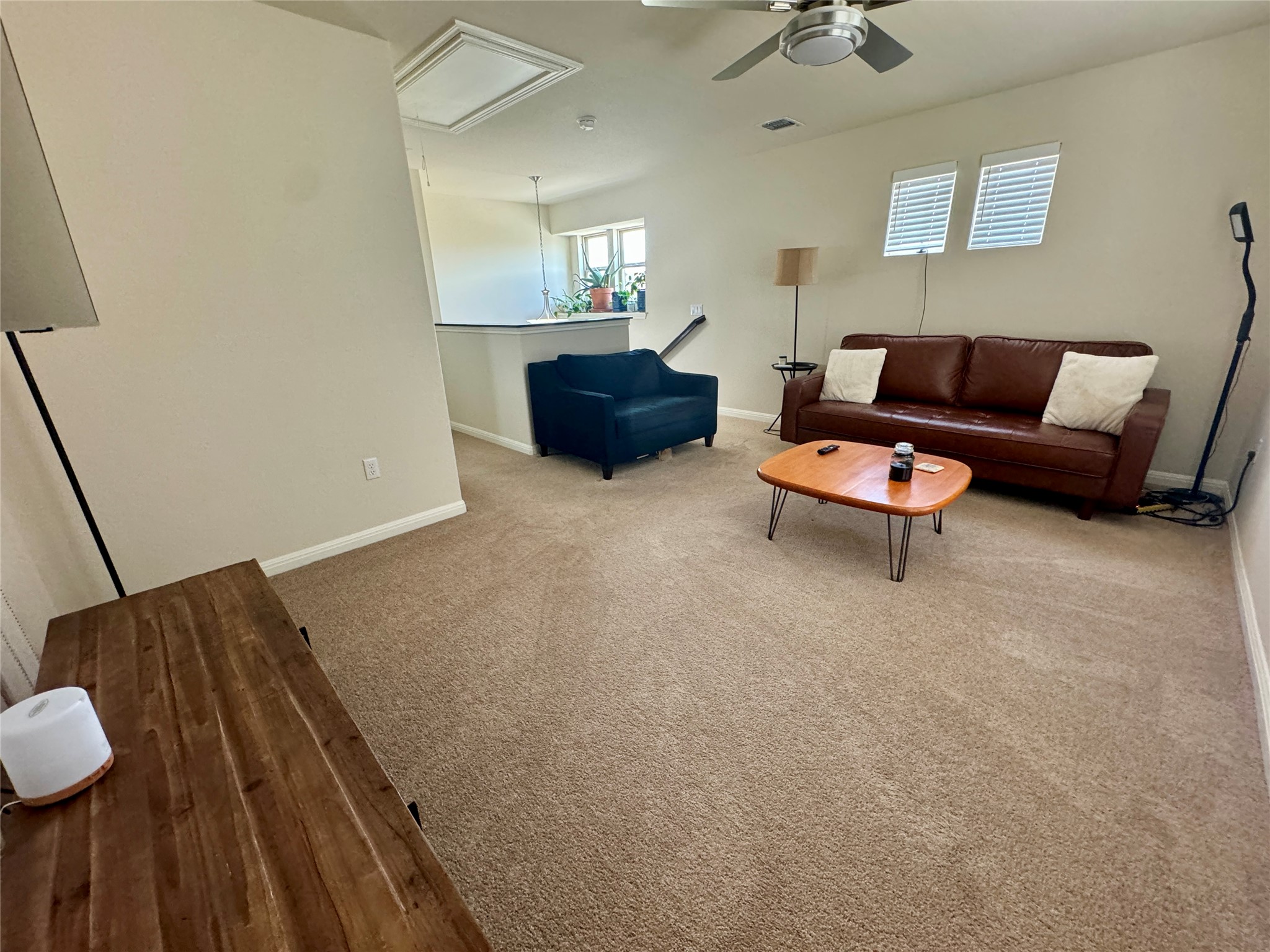 5904 Baythorne Drive Austin, TX 78747 - Photo 18 of 24 Loft with light colored carpet and a ceiling fan