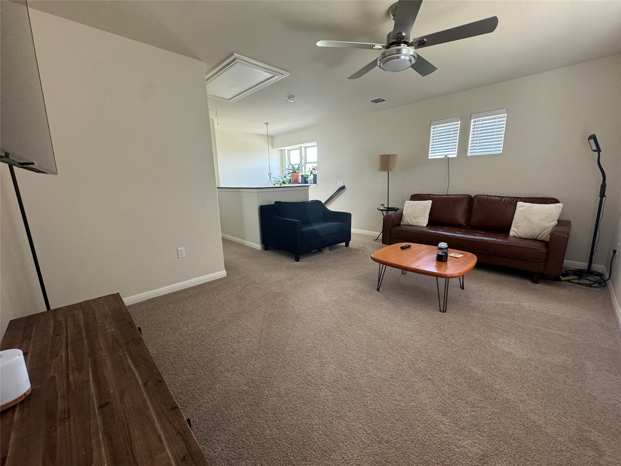 5904 Baythorne Drive Austin, TX 78747 - Photo 19 of 24 Loft featuring light carpet and a ceiling fan