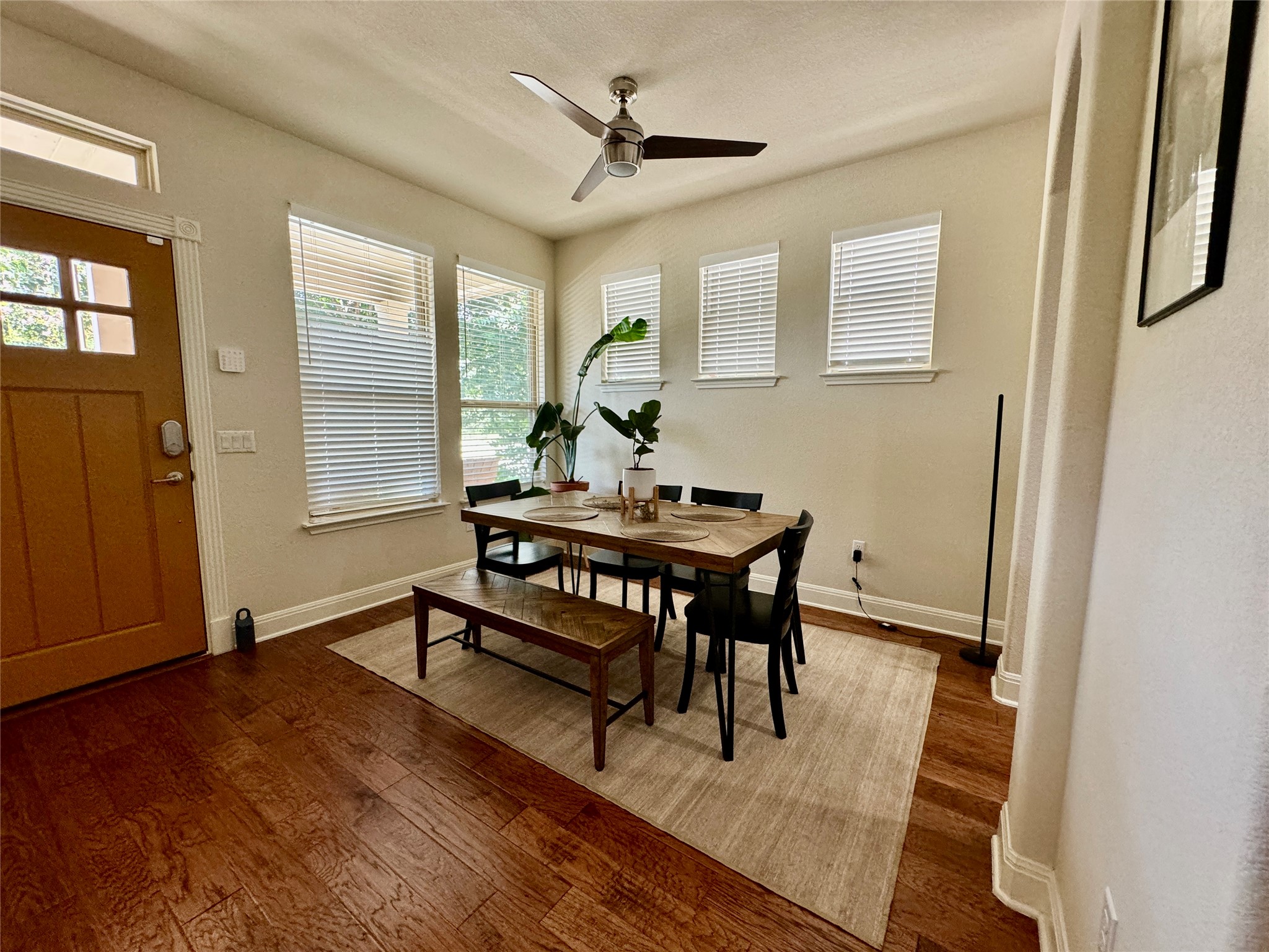 5904 Baythorne Drive Austin, TX 78747 - Photo 5 of 24 Dining area with hardwood / wood-style flooring and a ceiling fan