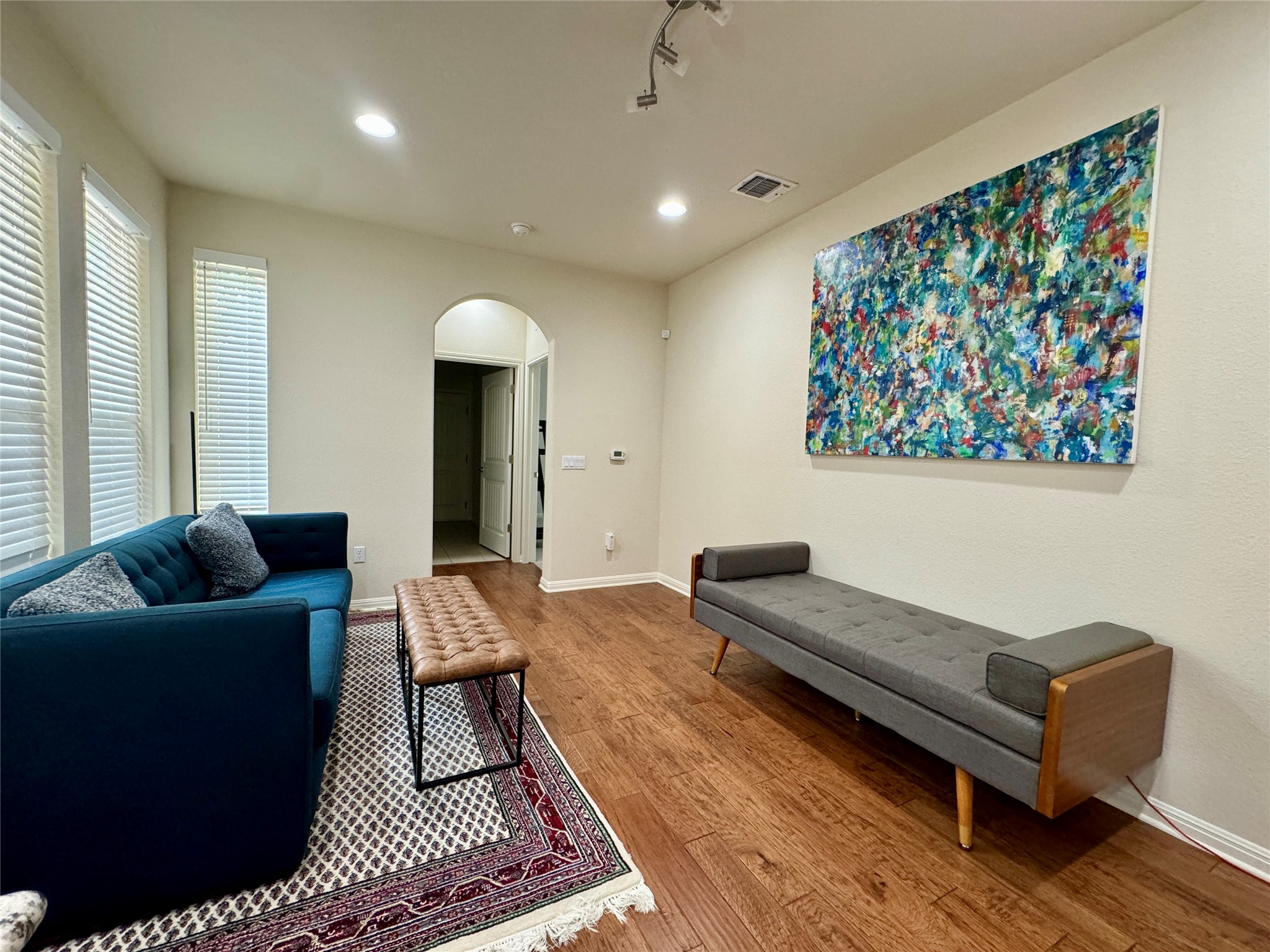 5904 Baythorne Drive Austin, TX 78747 - Photo 9 of 24 Living area with arched walkways, hardwood / wood-style floors, and recessed lighting