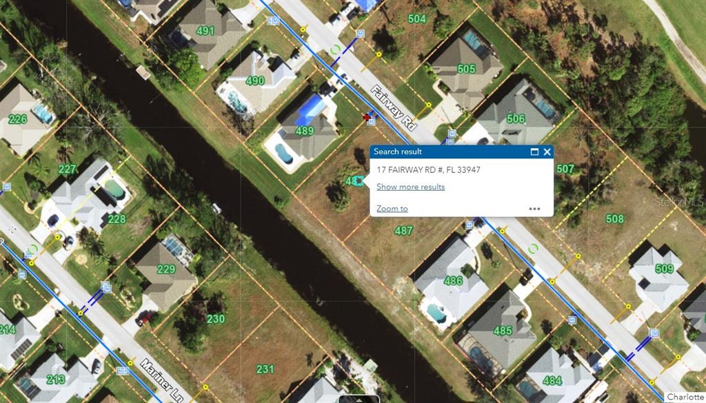 17 Fairway Road Rotonda West, FL 33947 - Photo 4 of 6 a sign that is on the side of a building