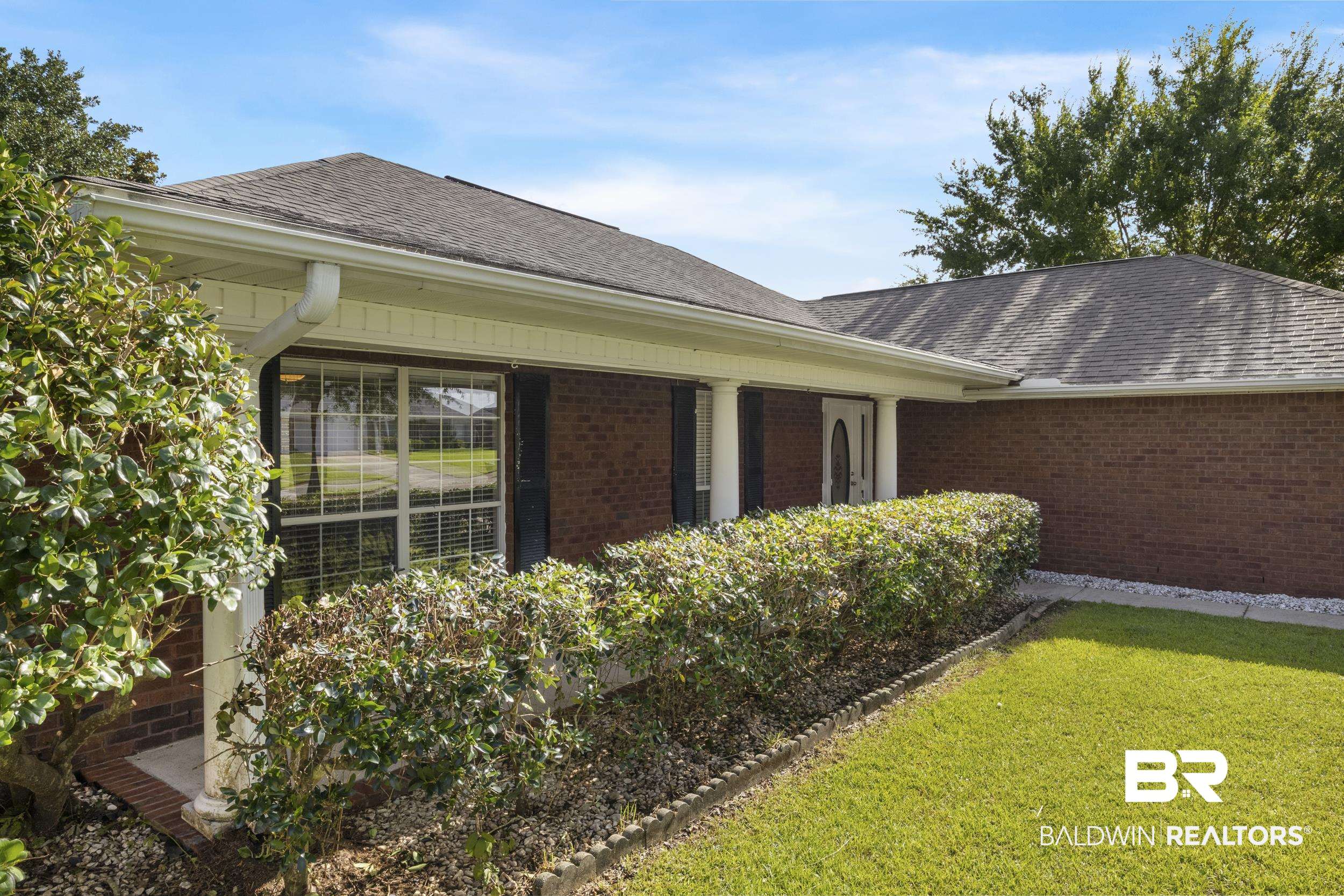 9610 Watkins Drive Fairhope, AL 36532 - Photo 17 of 26 View of side of property with a lawn