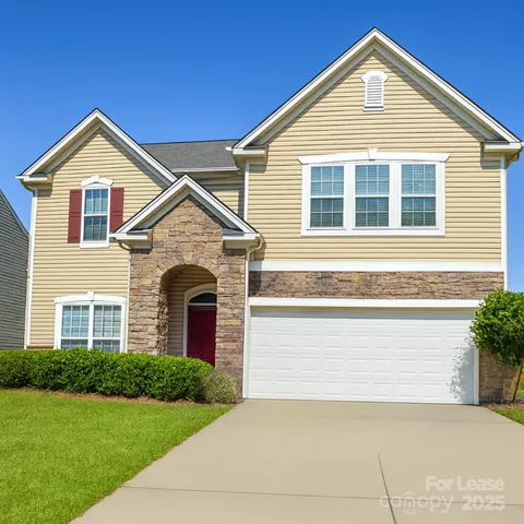 a front view of a house with yard