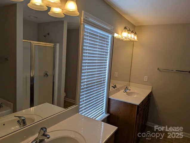 a bathroom with a sink and mirror