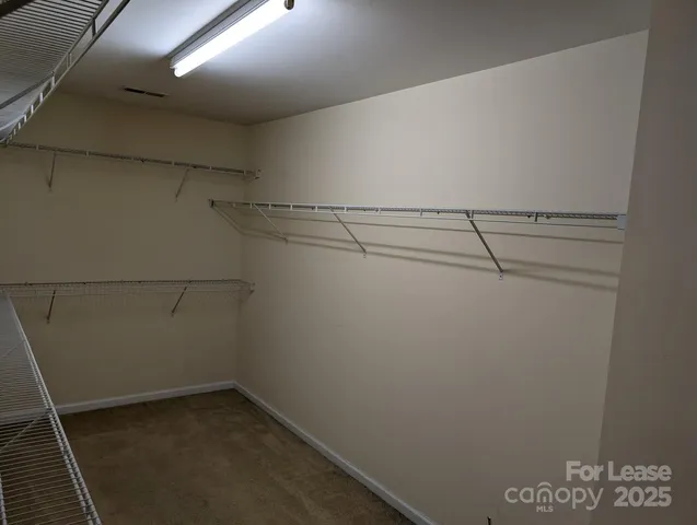 a view of a room with racks on the wall