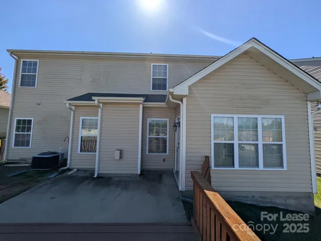 a front view of a house with a large window