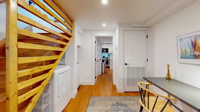 a room with wooden floor and furniture