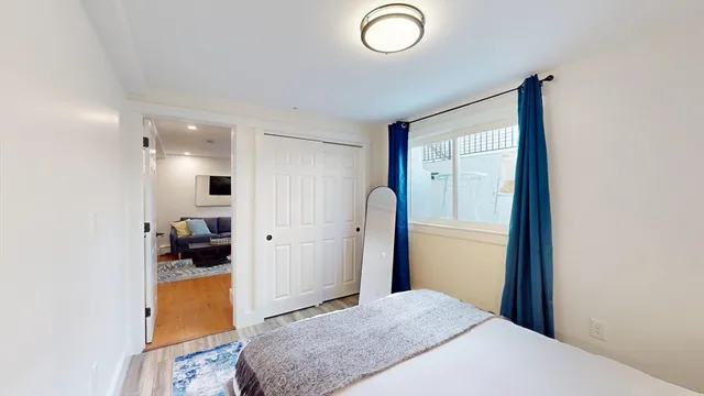 a bedroom with a bed and a view of bathroom