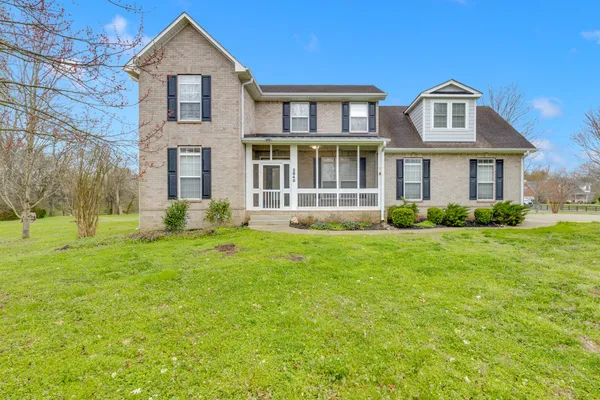 a front view of a house with a yard