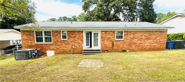 a front view of a house with many windows