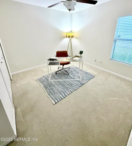 a living room with a rug