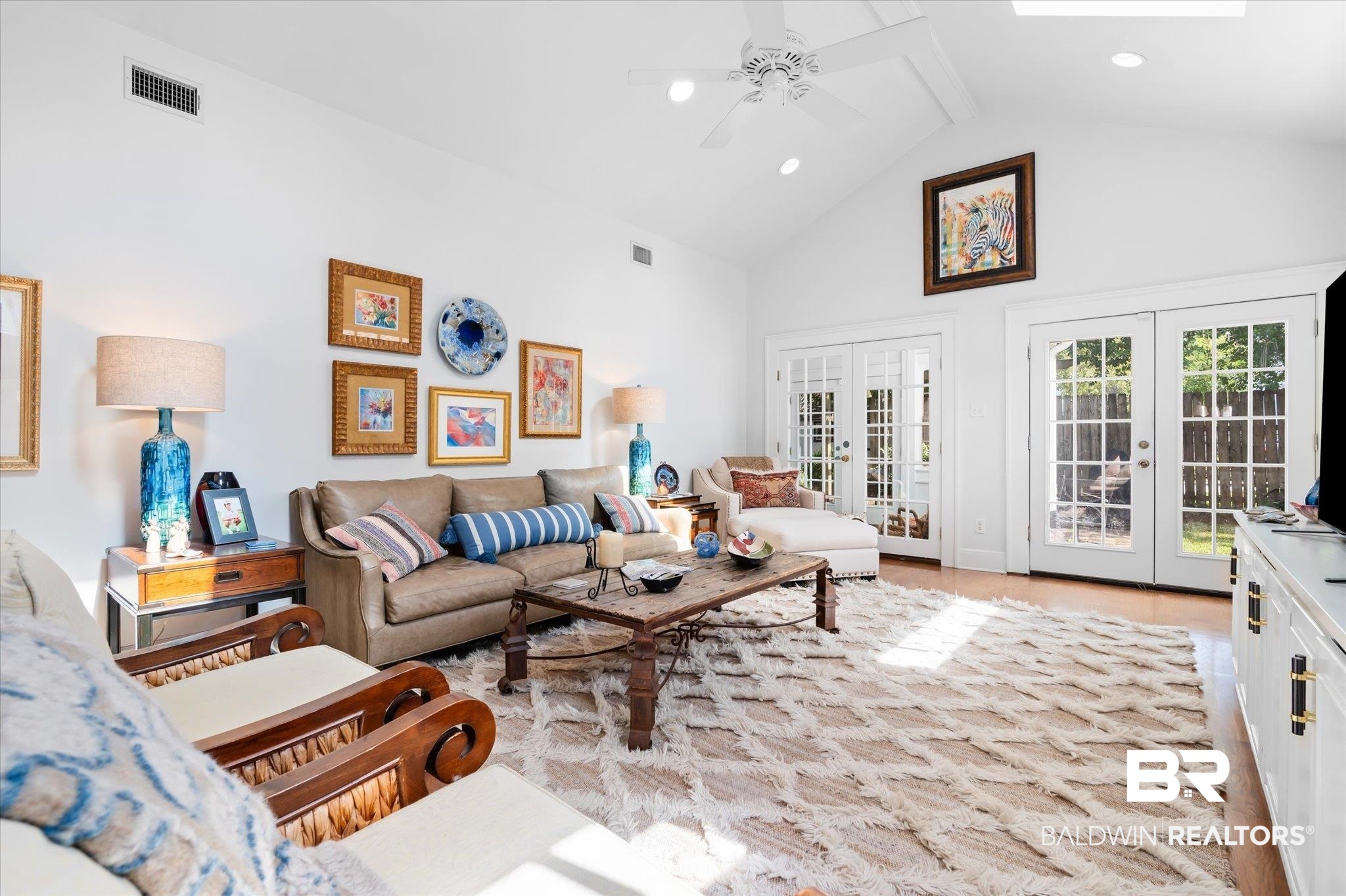 202 Woodlands Avenue Mobile, AL 36607 - Photo 24 of 53 Living room with french doors, beamed ceiling, light hardwood / wood-style flooring, high vaulted ceiling, and ceiling fan