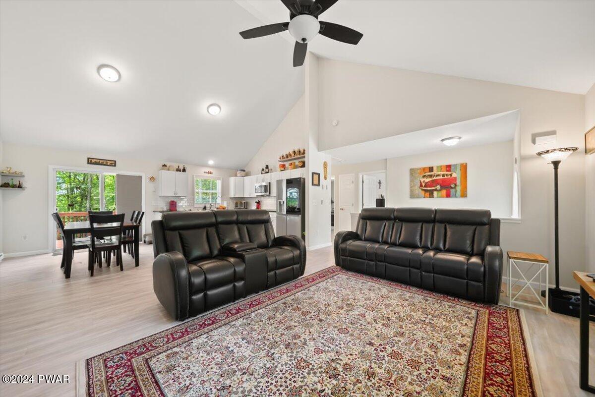 133 Butternut Road Milford, PA 18337 - Photo 6 of 34 a living room with furniture and a wooden floor