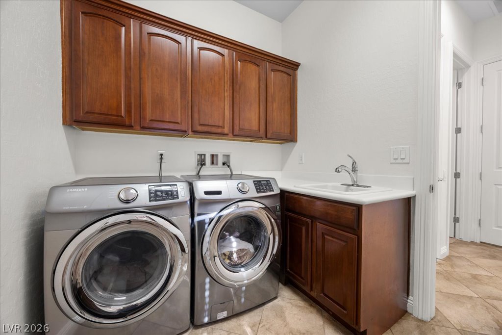 2125 De Rouge Avenue Henderson, NV 89044 - Photo 68 of 96 Functional laundry space featuring modern appliances and ample cabinet storage.