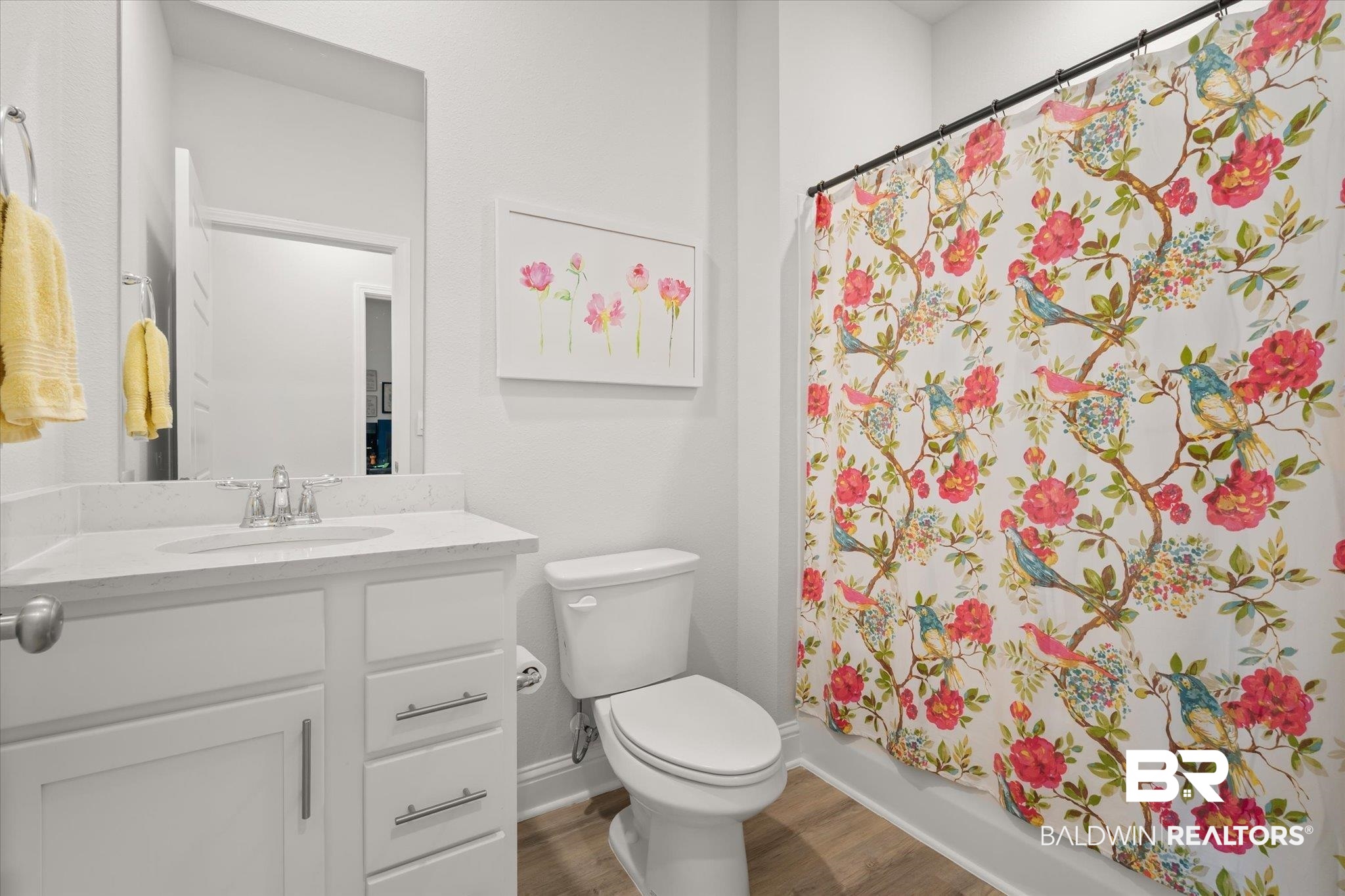 1167 Provision Road Mobile, AL 36608 - Photo 15 of 20 Bathroom with a shower with curtain, vanity, toilet, and wood finished floors